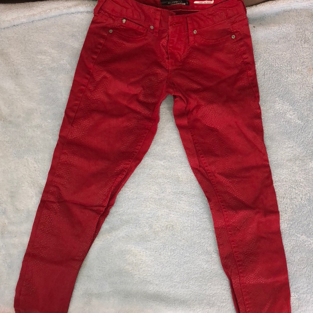 Red snakeskin jeans